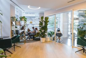 A group of people sitting around in an office.